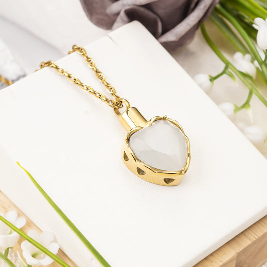 Gold heart pendant with white stone for ashes