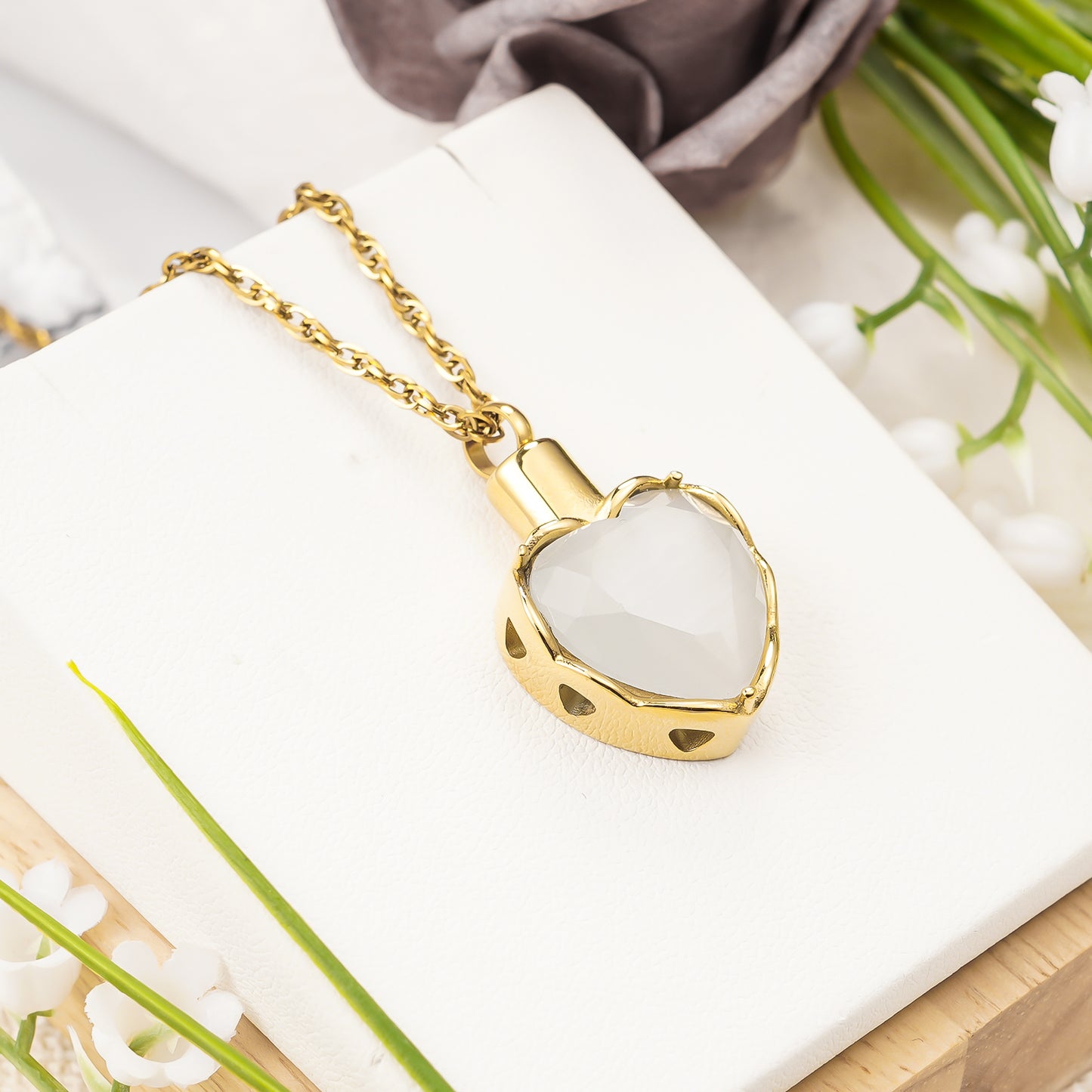 Gold heart pendant with white stone for ashes