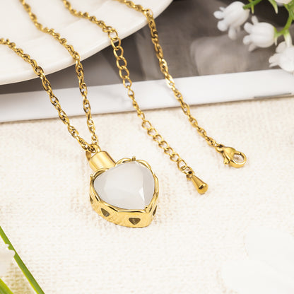 Gold heart pendant with white stone for ashes