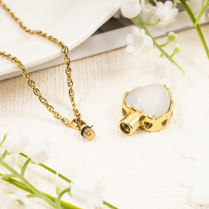 Gold heart pendant with white stone for ashes