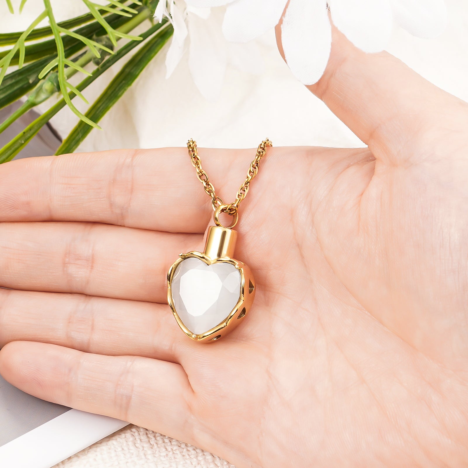 Gold heart pendant with white stone for ashes